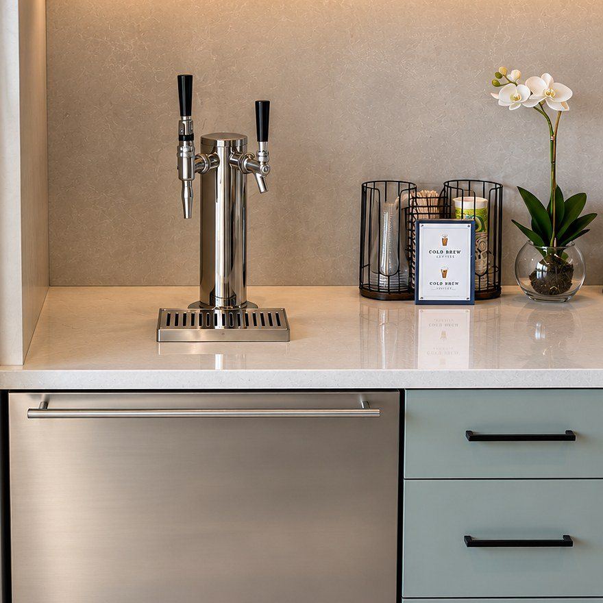 Cold brew tap, cups and menu card set up on an office counter